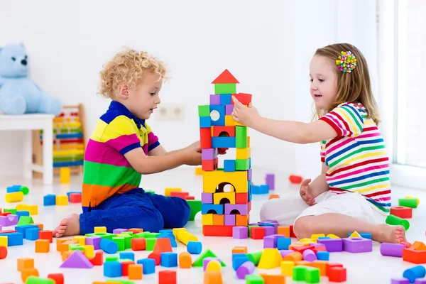 depositphotos_119829630 stock photo kids playing with colorful toy